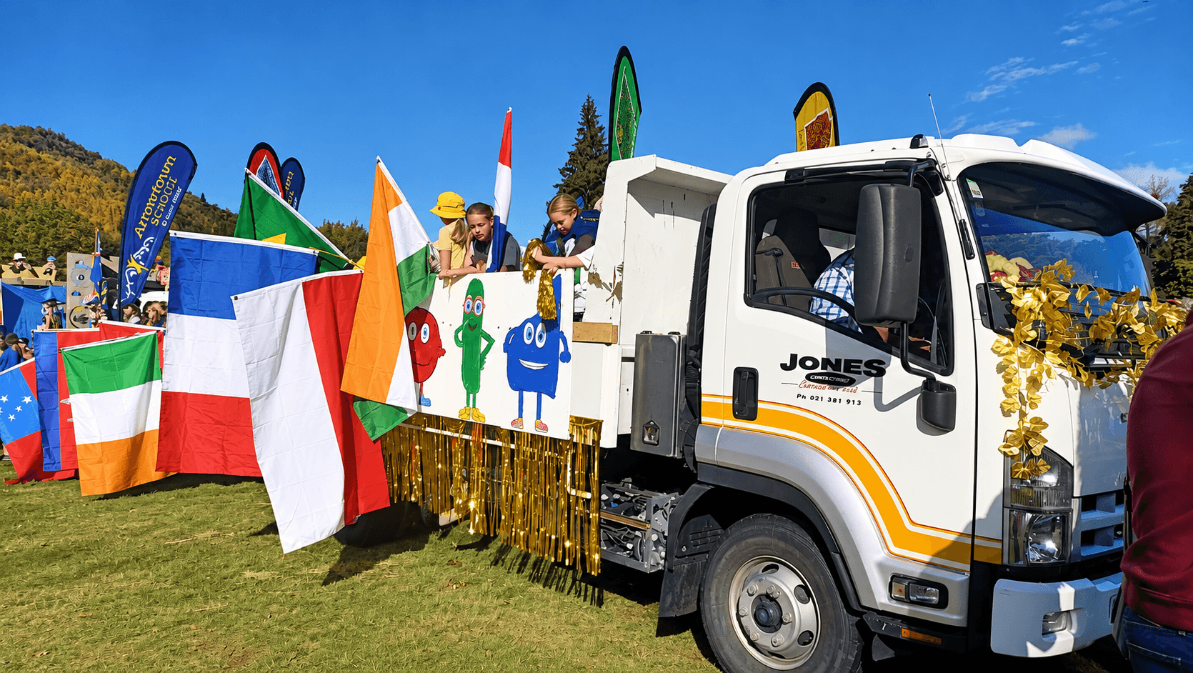 A decorated school truck at a community parade